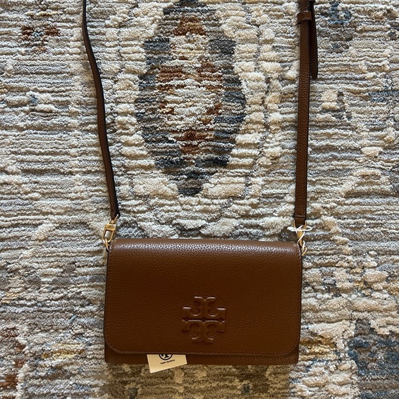 Tory Burch, never been used. Tag still on bag. Brown leather - Picture 1 of 3